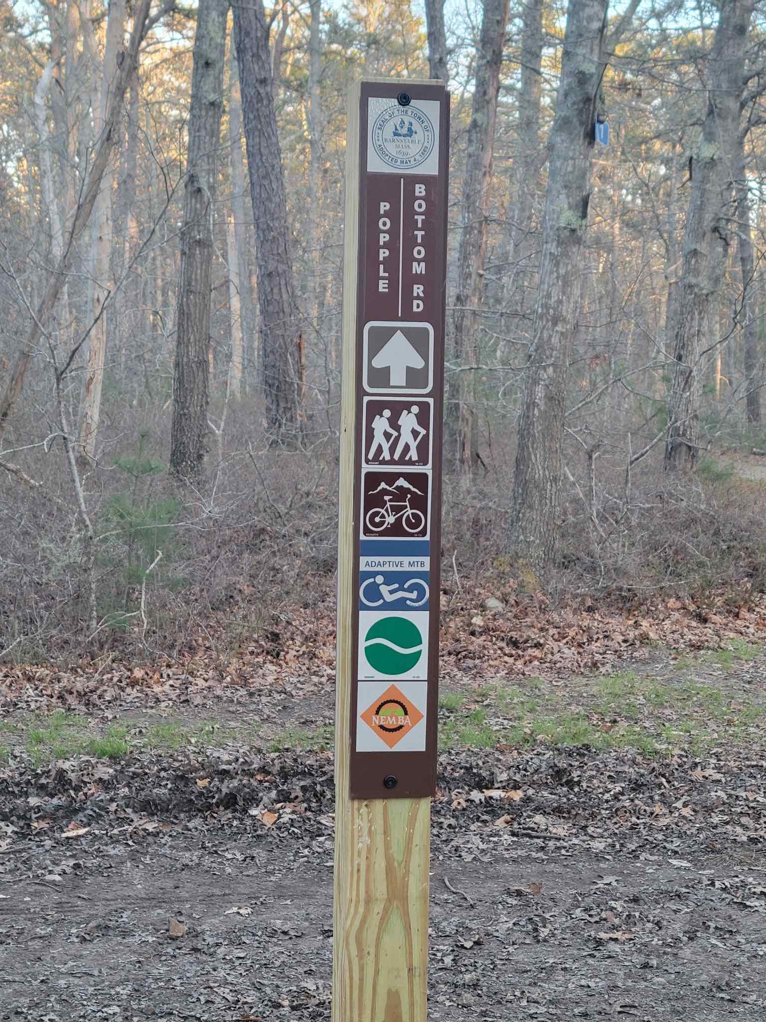 Signpost showing trail name and trail user types at West Barnstable Conservation Area